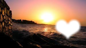 coeur au coucher du soleil rochers Montaje fotografico